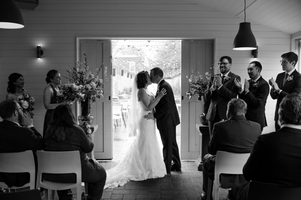 bride and groom kissing at Gufo restaurant wedding venue in Cambridge MA